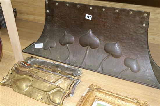 Two Art Nouveau copper panels, a similar fire curb, various brass finger plates and escutcheons